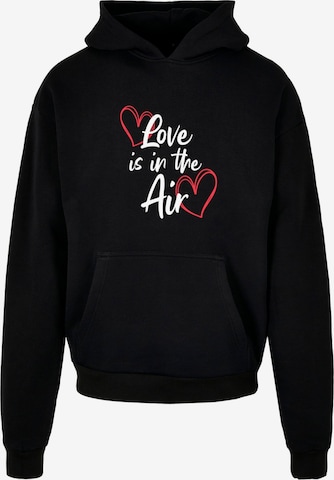 Sweat-shirt 'Valentines Day - Love Is In The Air' Merchcode en noir : devant