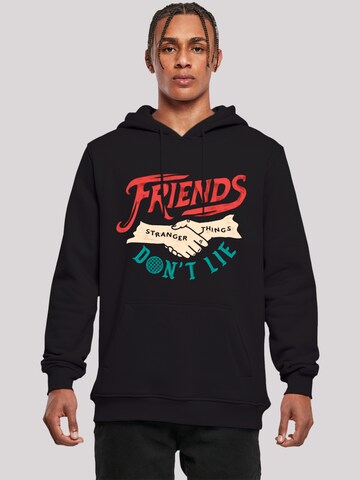 Sweat-shirt 'Stranger Things Friends Dont Lie Netflix TV Series' F4NT4STIC en noir : devant