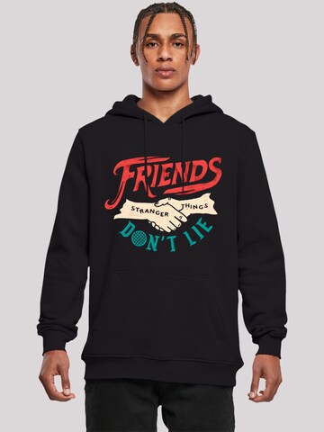 F4NT4STIC Sweatshirt 'Stranger Things Friends Dont Lie Netflix TV Series' in Zwart: voorkant