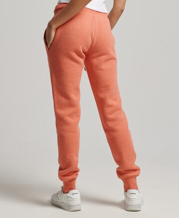 Effilé Pantalon de sport Superdry en orange