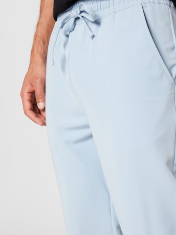 Urban Classics Tapered Trousers in Blue