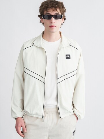 Nike Sportswear Prehodna jakna 'AIR' | bež barva