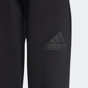 ADIDAS SPORTSWEAR Tapered Sports trousers 'Future Icons' in Black