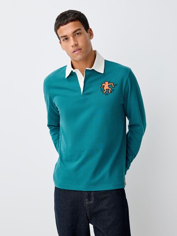 Next T-shirt i blå: framsida