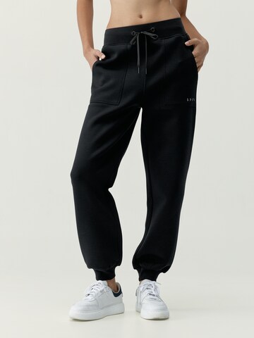 Born Regular Sports trousers ' Bloom ' in Black: front