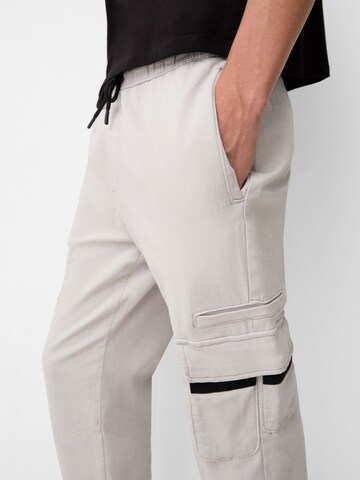 Bershka Tapered Cargo trousers in Grey