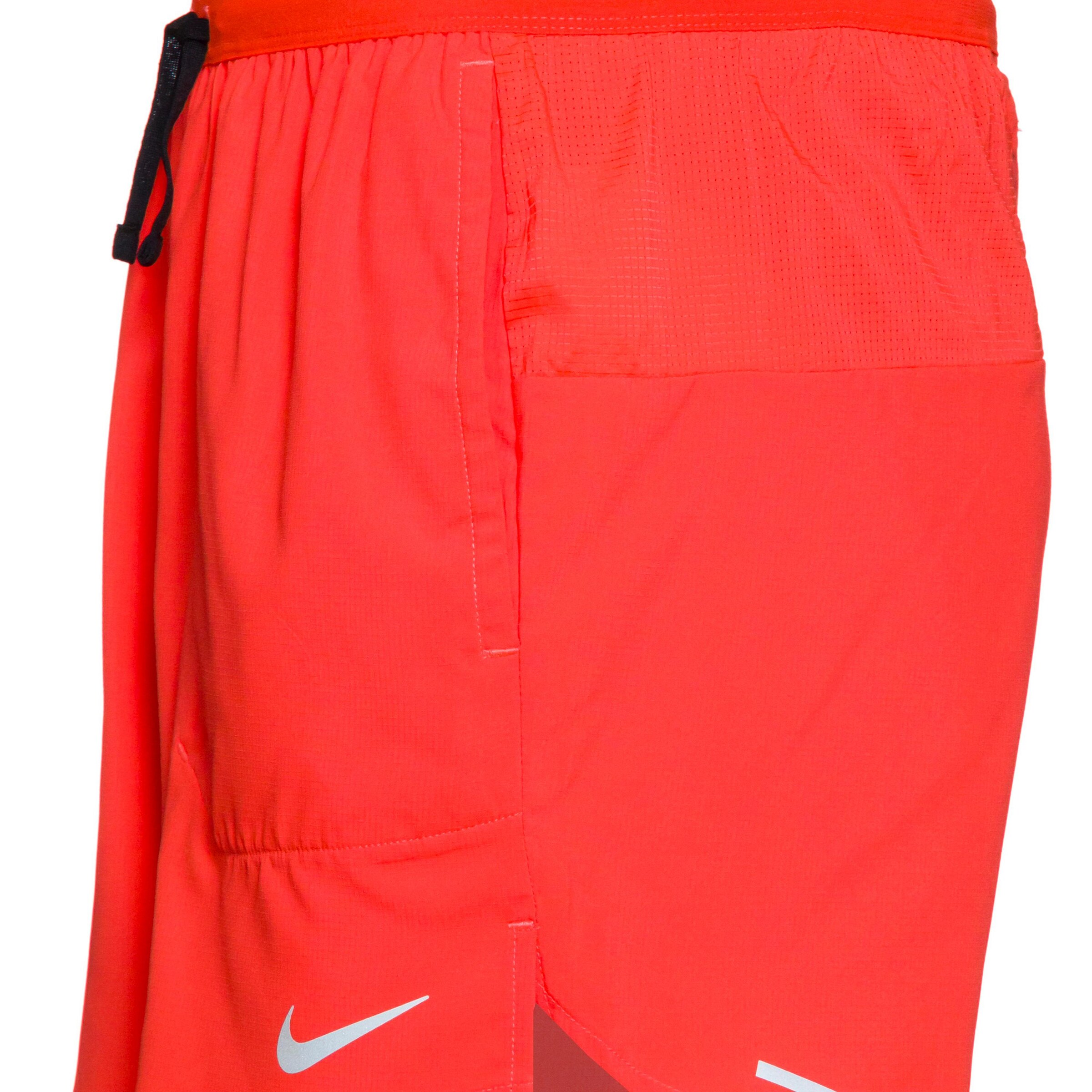 NIKE Regular Workout Pants 'Flex Stride' in Red