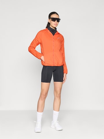NIKE Sportovní bunda – červená
