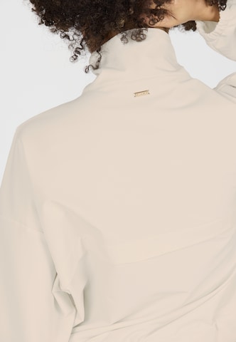 Athlecia Performance shirt 'Carley' in Beige