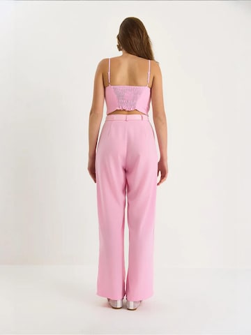 Completo pantalone di Bianco Lucci in rosa