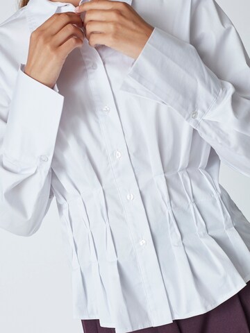 Chemisier 'Poppy' co'couture en blanc