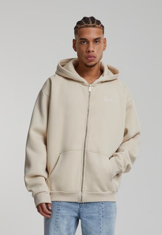 Veste de survêtement 'Essential' Karl Kani en beige : devant