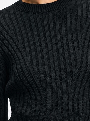 Robes en maille 'Strickkleider' Ethiquet en noir