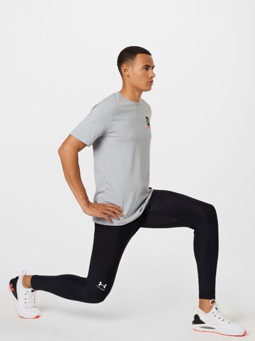 Tricou funcțional de la UNDER ARMOUR pe gri