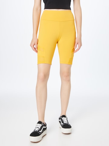 Urban Classics Skinny Leggings in Yellow: front