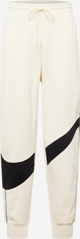 Nike Sportswear Tapered Trousers in White: front