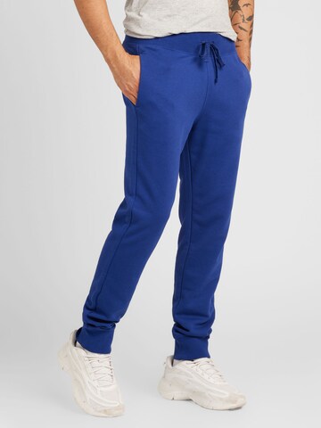 Tapered Pantaloni 'Legacy' de la Champion Authentic Athletic Apparel pe albastru: față