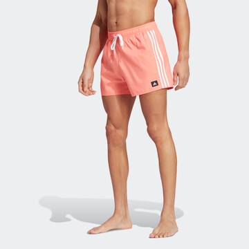 ADIDAS SPORTSWEAR - Calções de banho desportivos em laranja: frente