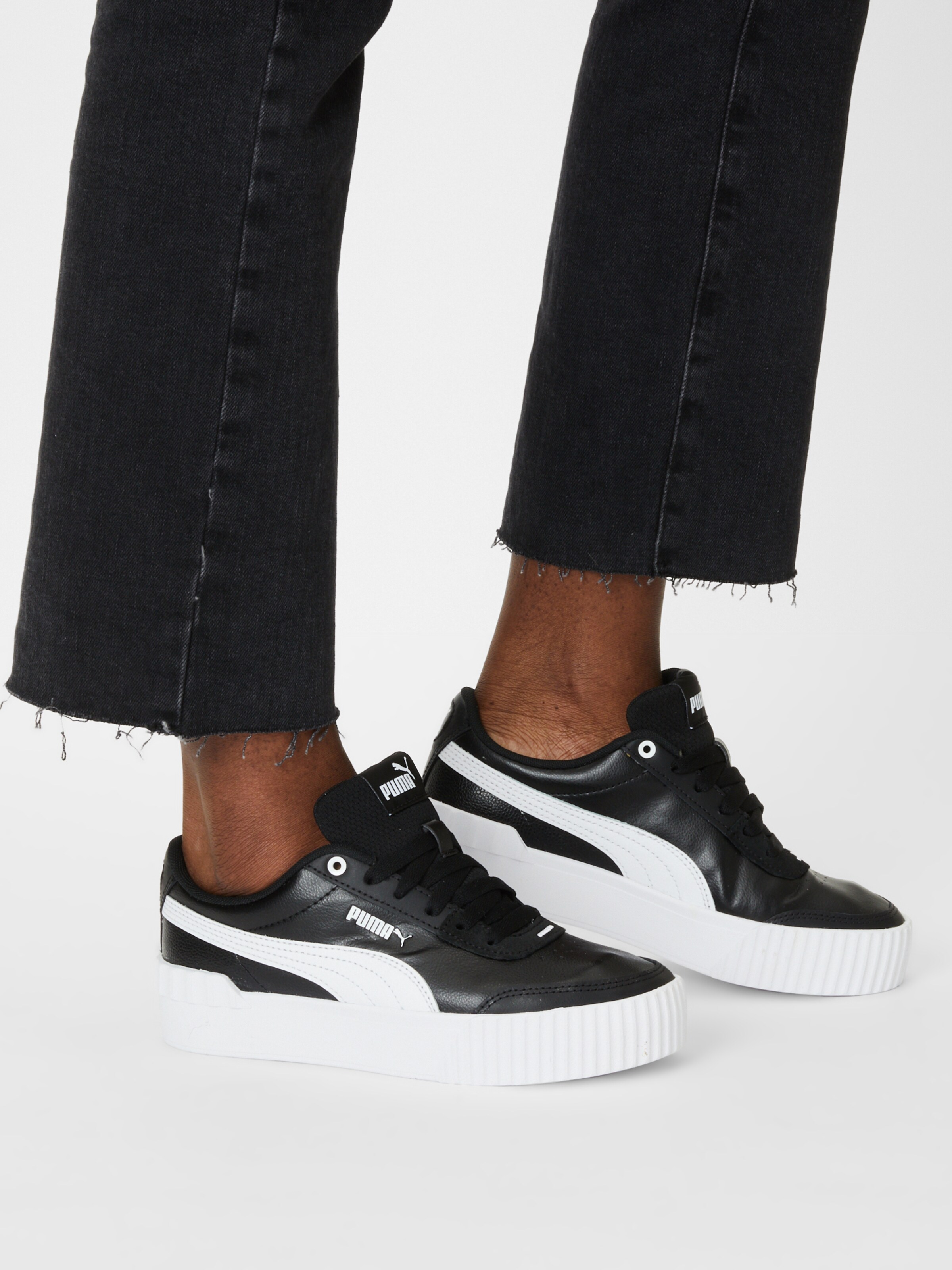 puma carina sneaker on feet