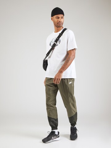 Effilé Pantalon 'Windrunner' Nike Sportswear en vert