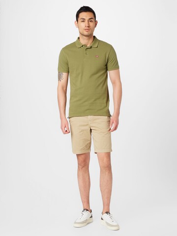 LEVI'S ® T-shirt 'Housemark Polo' i grön