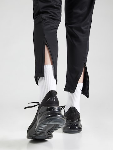 NIKE Regular Workout Pants 'ACD25' in Black