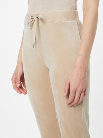 Gina Tricot Flared Hose 'Melinda' in Beige