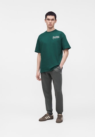 ADIDAS ORIGINALS - Camiseta 'Undel' en verde