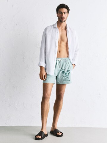 Shorts de bain 'Snoopy' Next en vert