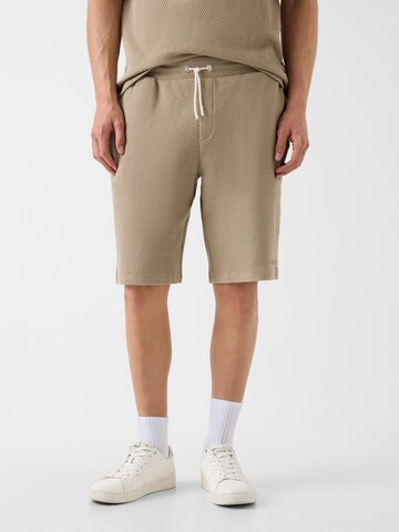 GUESS Loose fit Pants in Beige: front