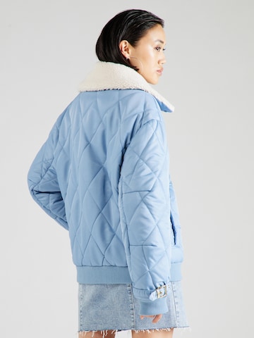 Hoermanseder x About You Between-Season Jacket 'Lucia' in Blue