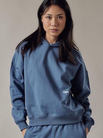 Sweat-shirt 'Cappuccio' OWN Off With Nature en bleu : devant