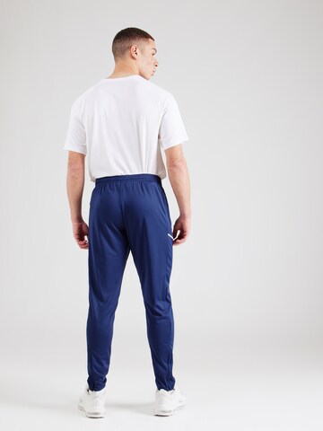 NIKE Tapered Urheiluhousut 'Academy 25' värissä sininen