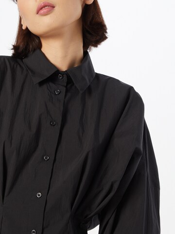 Sisley - Blusa en negro