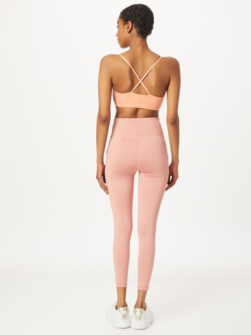 PUMA Skinny Sports trousers in Pink