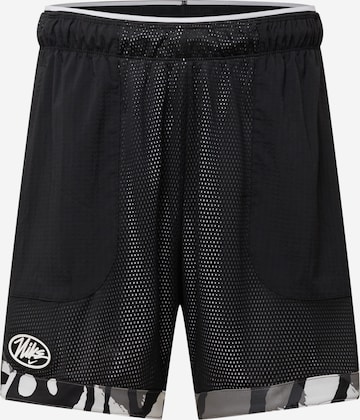 Pantaloni sport de la NIKE pe negru: față