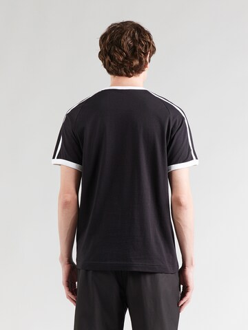 Maglietta 'T7 Big Cat Ringer' di PUMA in nero