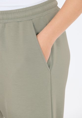 Athlecia Tapered Sportbroek 'Jacey' in Groen