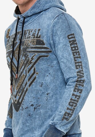 Rusty Neal Sweatshirt mit Oil Washed Front Print in Blau