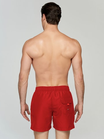 Marc & André Board Shorts in Red