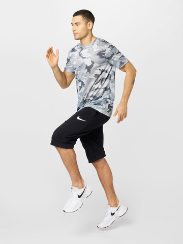 NIKE Loosefit Sportbroek in Zwart