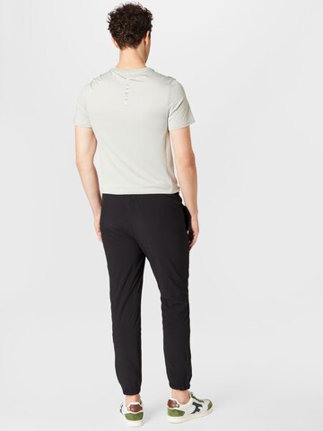 ELLESSE Tapered Workout Pants 'Ezio' in Black