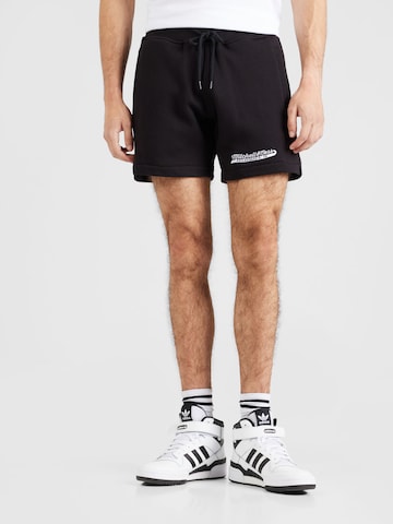 Regular Pantalon de sport Mitchell & Ness en noir : devant