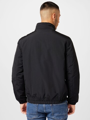 Veste mi-saison 'Essential' Tommy Jeans en noir