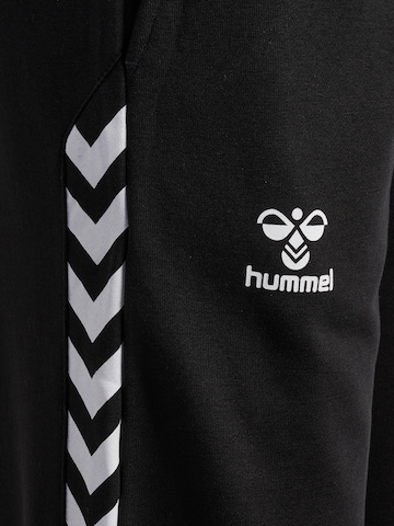Hummel - Tapered Pantalón deportivo 'Staltic' en negro