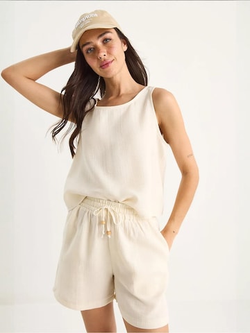 Pantalons de tailleur Bianco Lucci en beige