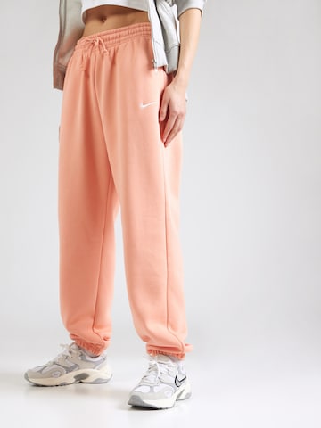 Tapered Pantaloni 'PHNX FLC' de la Nike Sportswear pe portocaliu: față