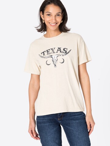 Nasty Gal Υπερμέγεθες μπλουζάκι 'Texas' σε μπεζ: μπροστά
