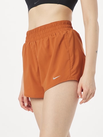 NIKE Regular Workout Pants 'One' in Brown