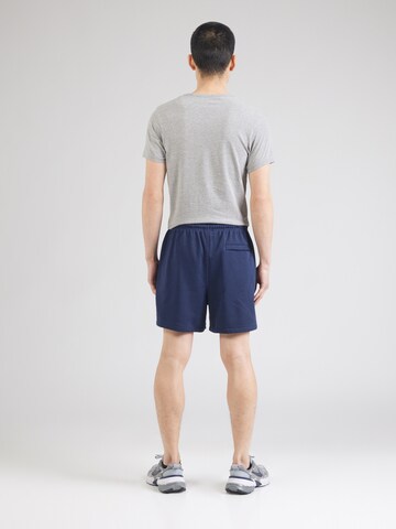 Nike Sportswear Loosefit Bukser 'CLUB' i blå